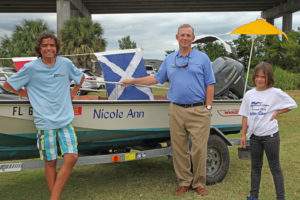 Mike Mitchell (center) flanked by YSF sailors Peik and Ronja Sander