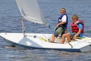 Two young boys sailing