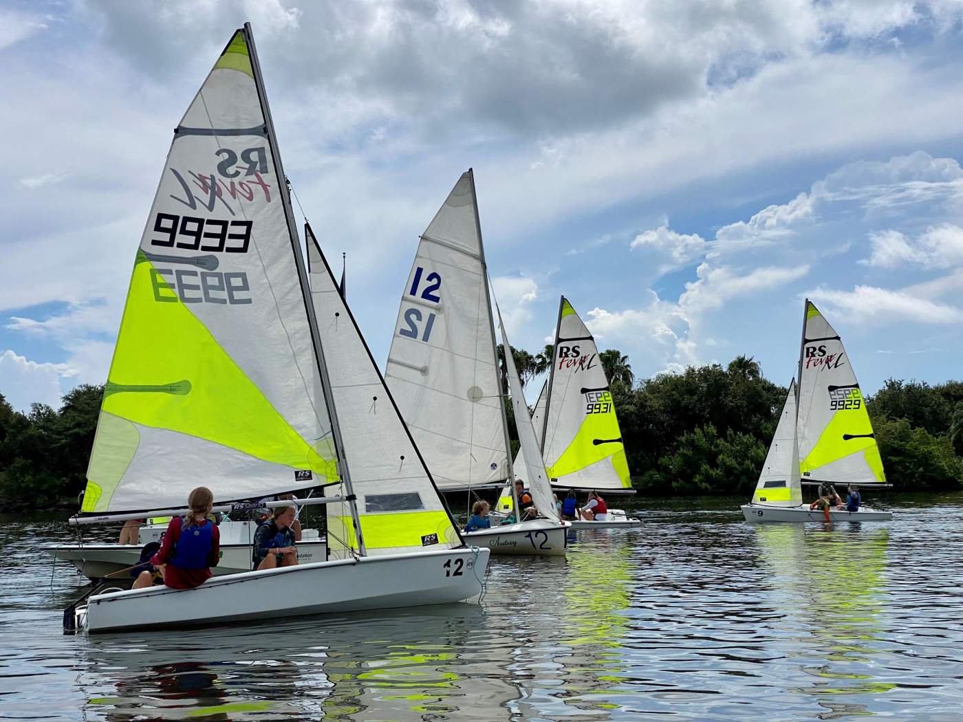 A group of sailboats sailing in the lagoon