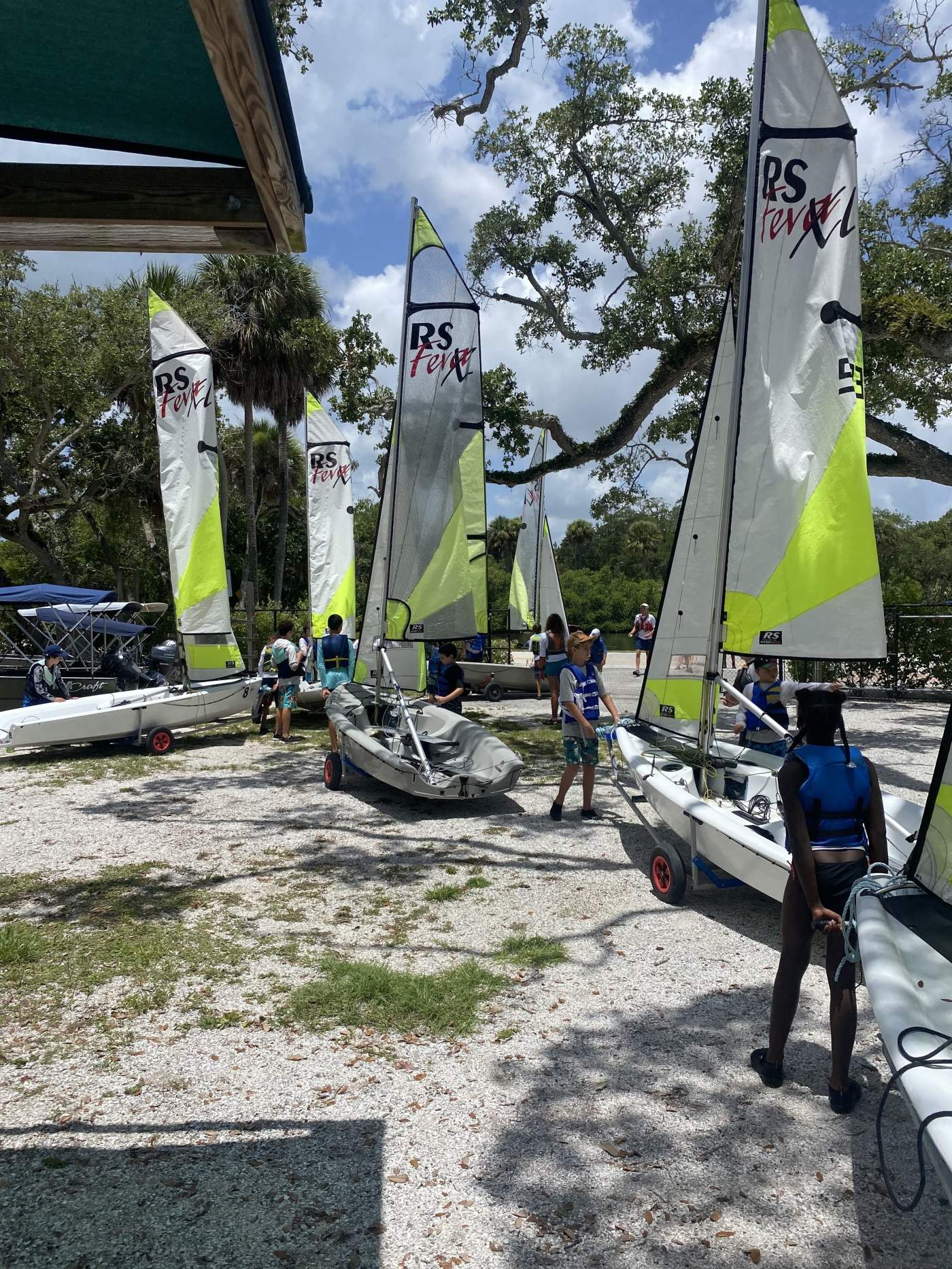 Boats on the beach being prepared for sailing