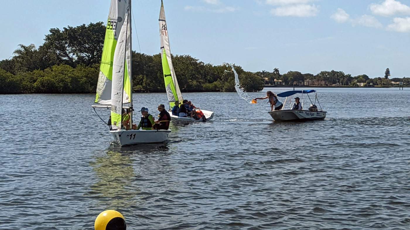 Three boats approaching a buoy