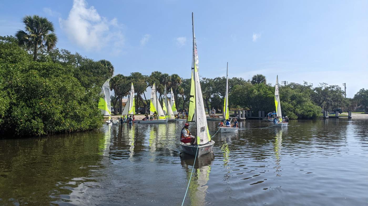 A sailboat being towed