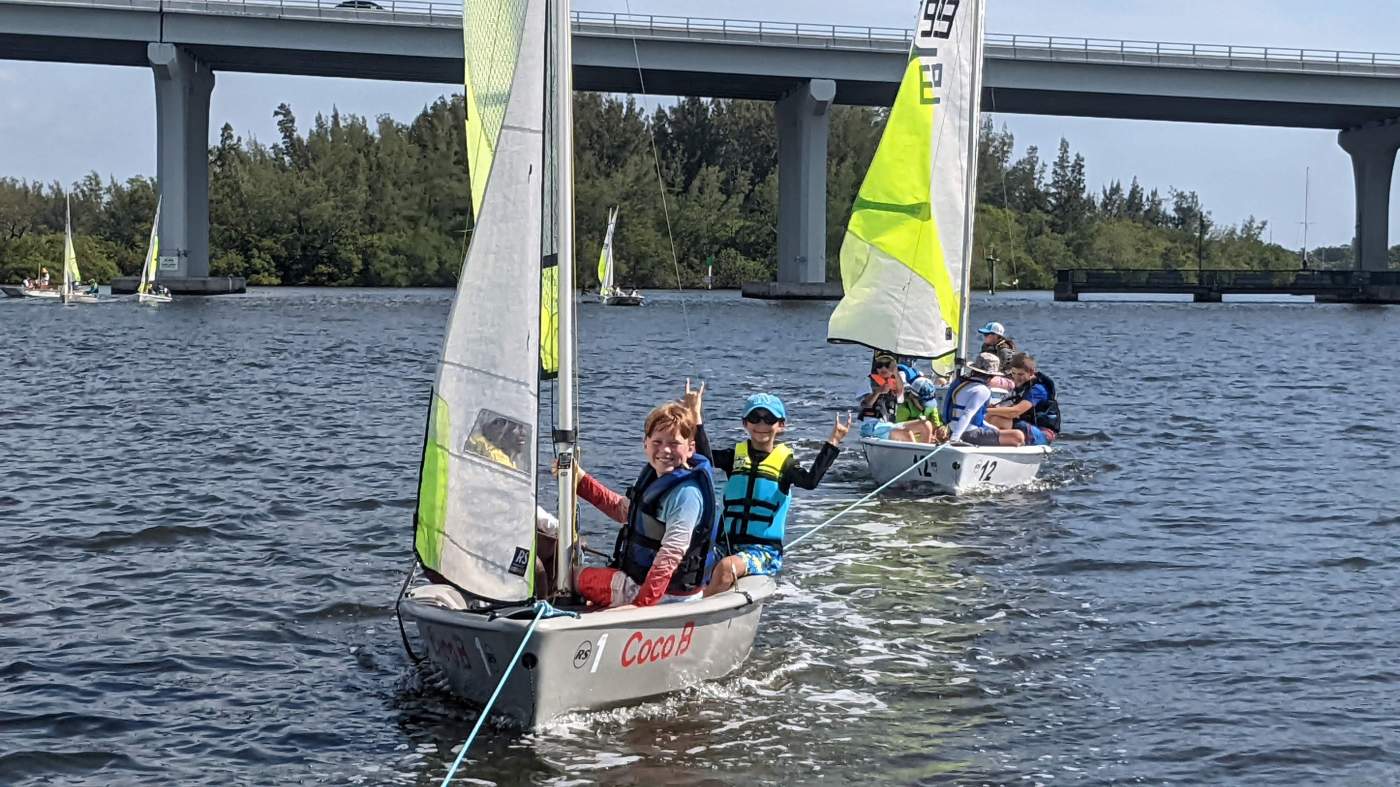 A sailboat being towed