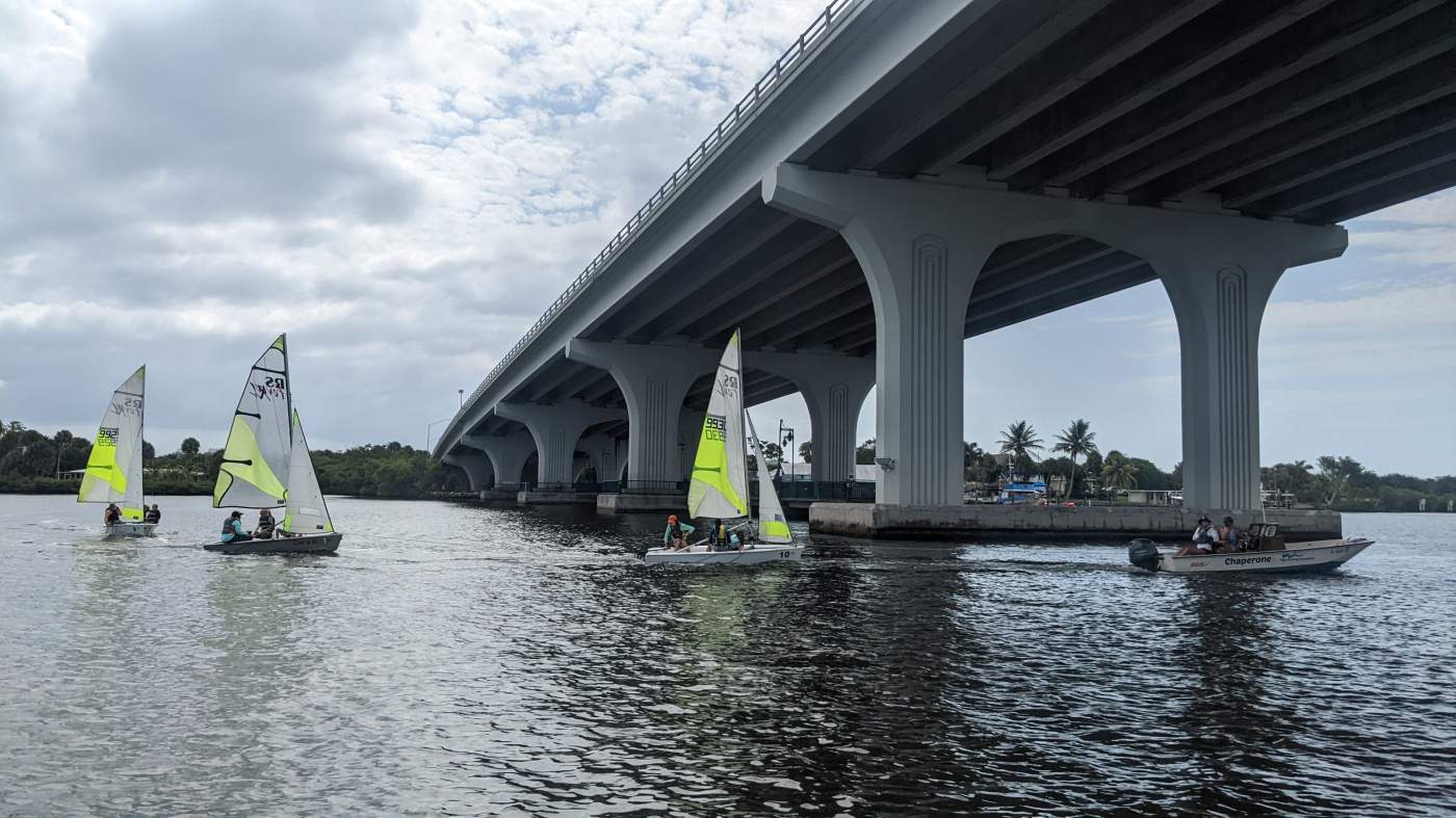 Three sailboats near the bridge