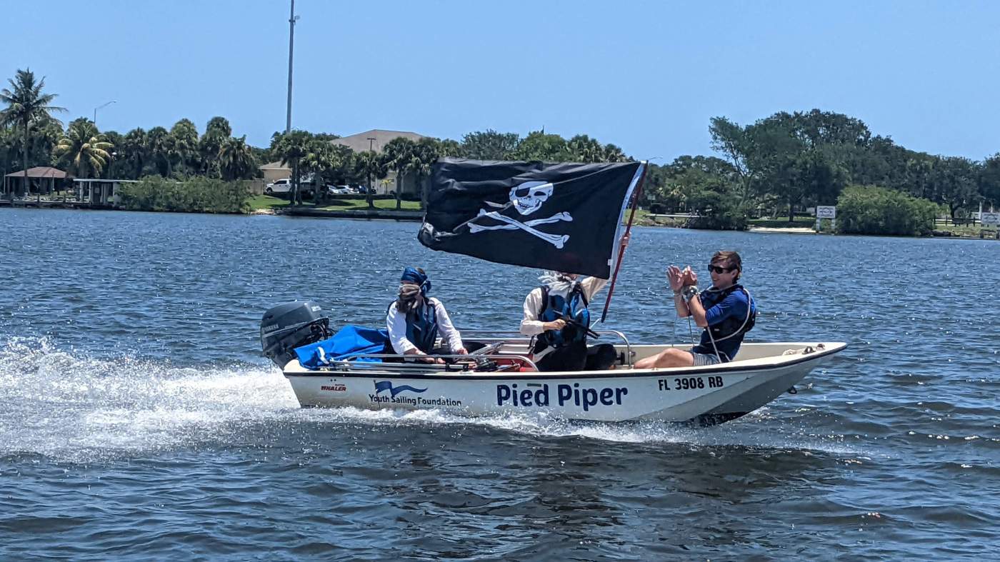 A powerboat with a pirate flag