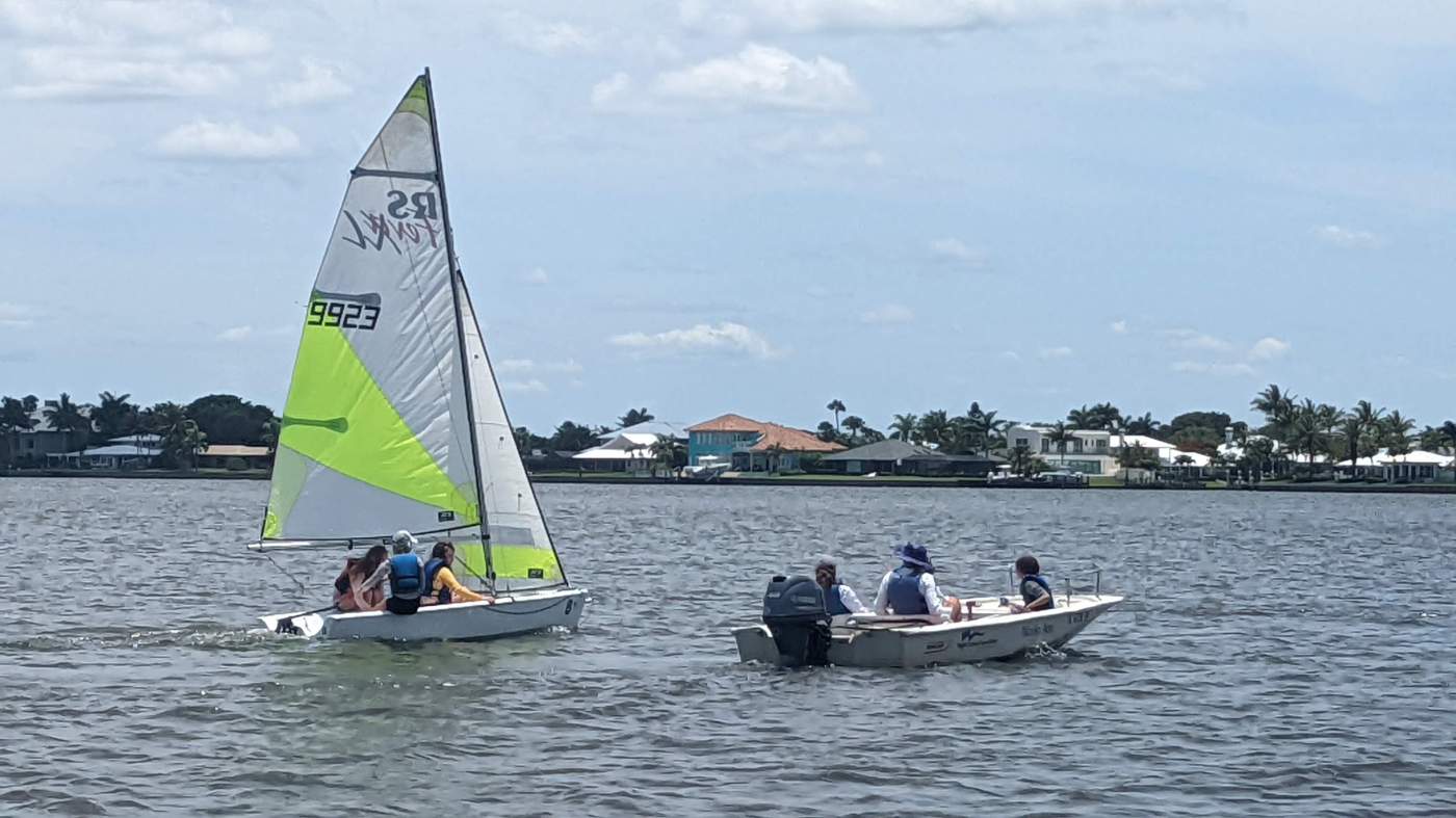 A sailboat and a powerboat out on the lagoon