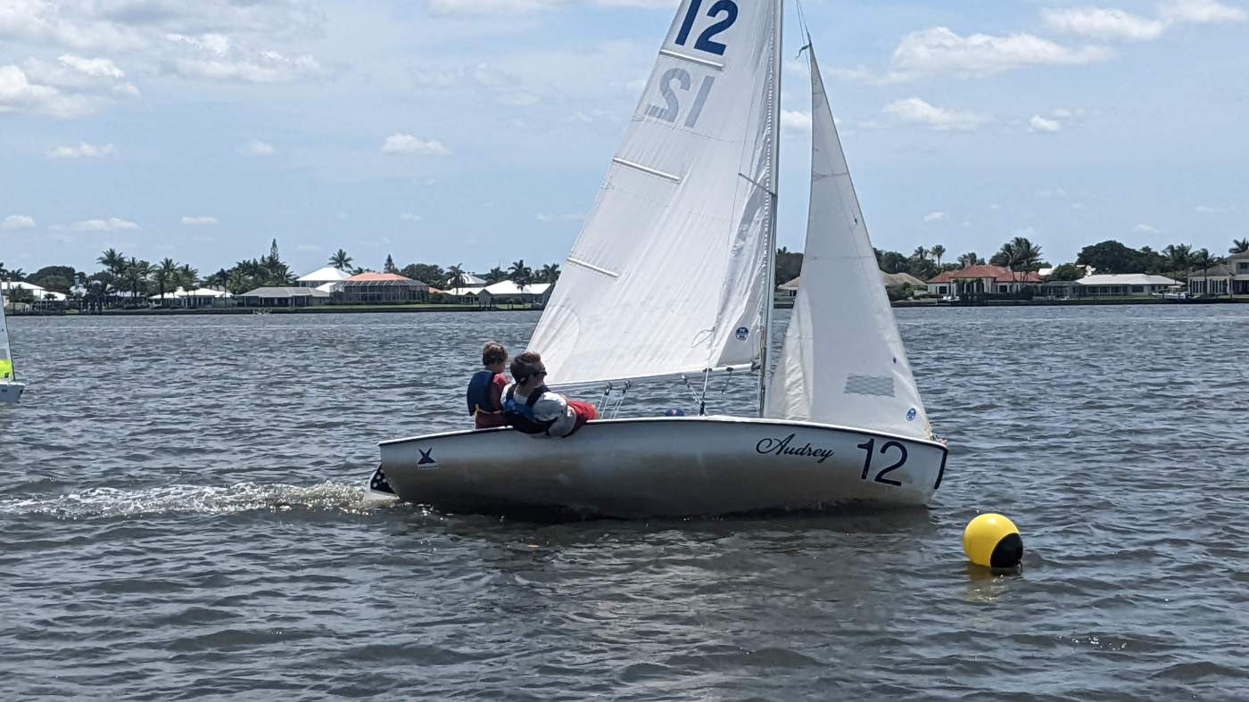 Sailboat rounding a buoy