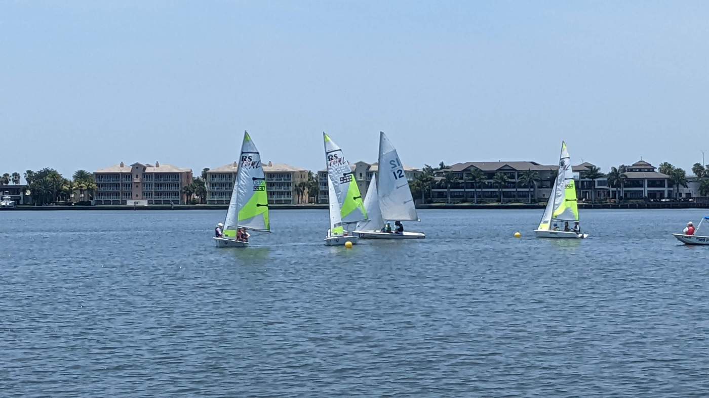 A group of sailboats sailing in the lagoon