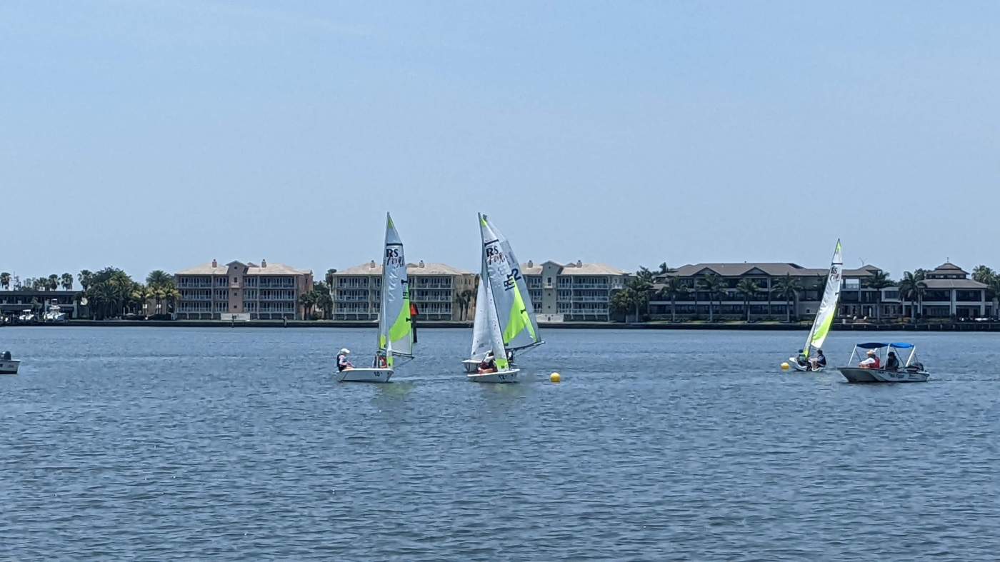 Sailboats rounding a buoy