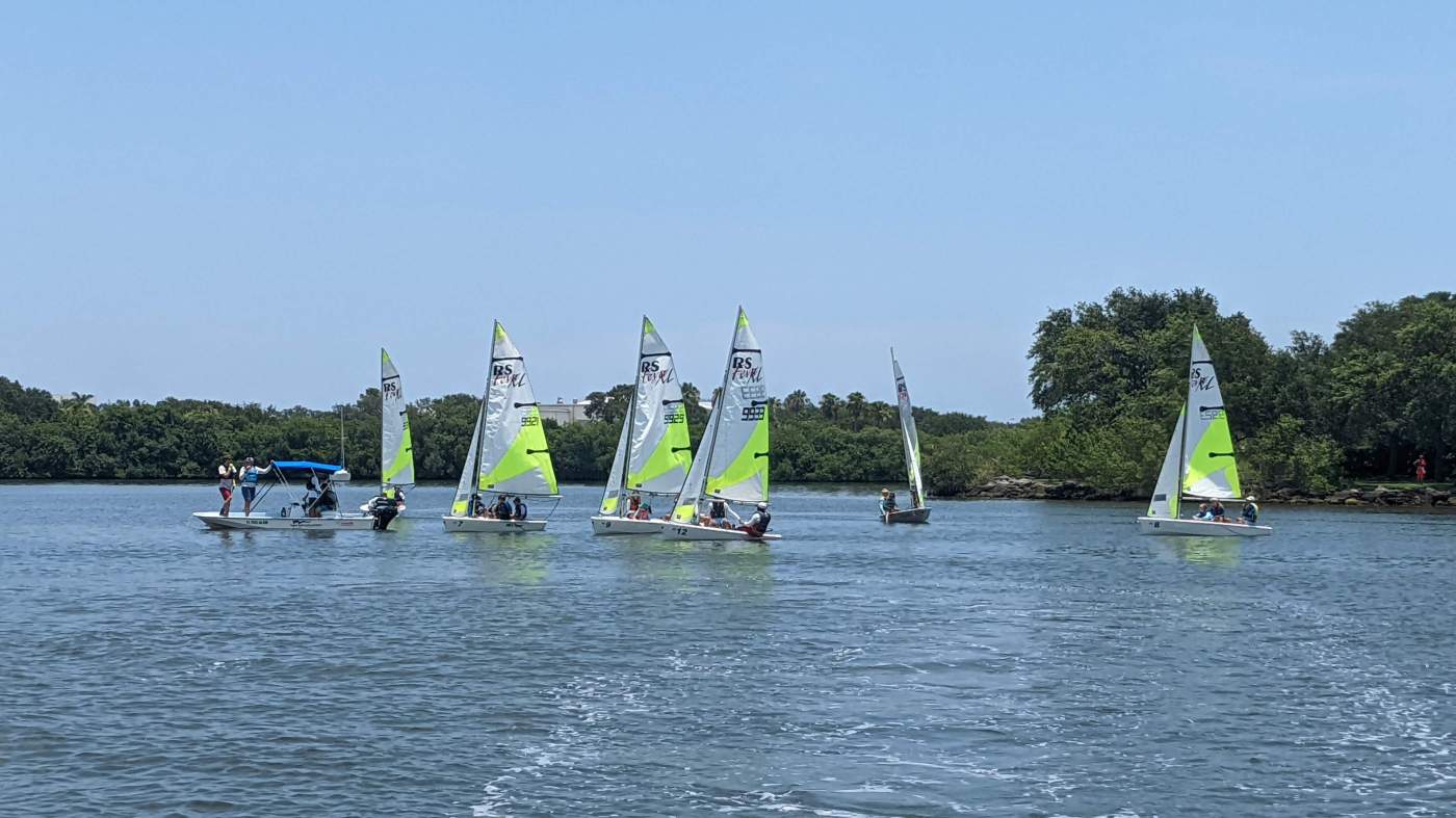 A group of sailboats sailing in the lagoon