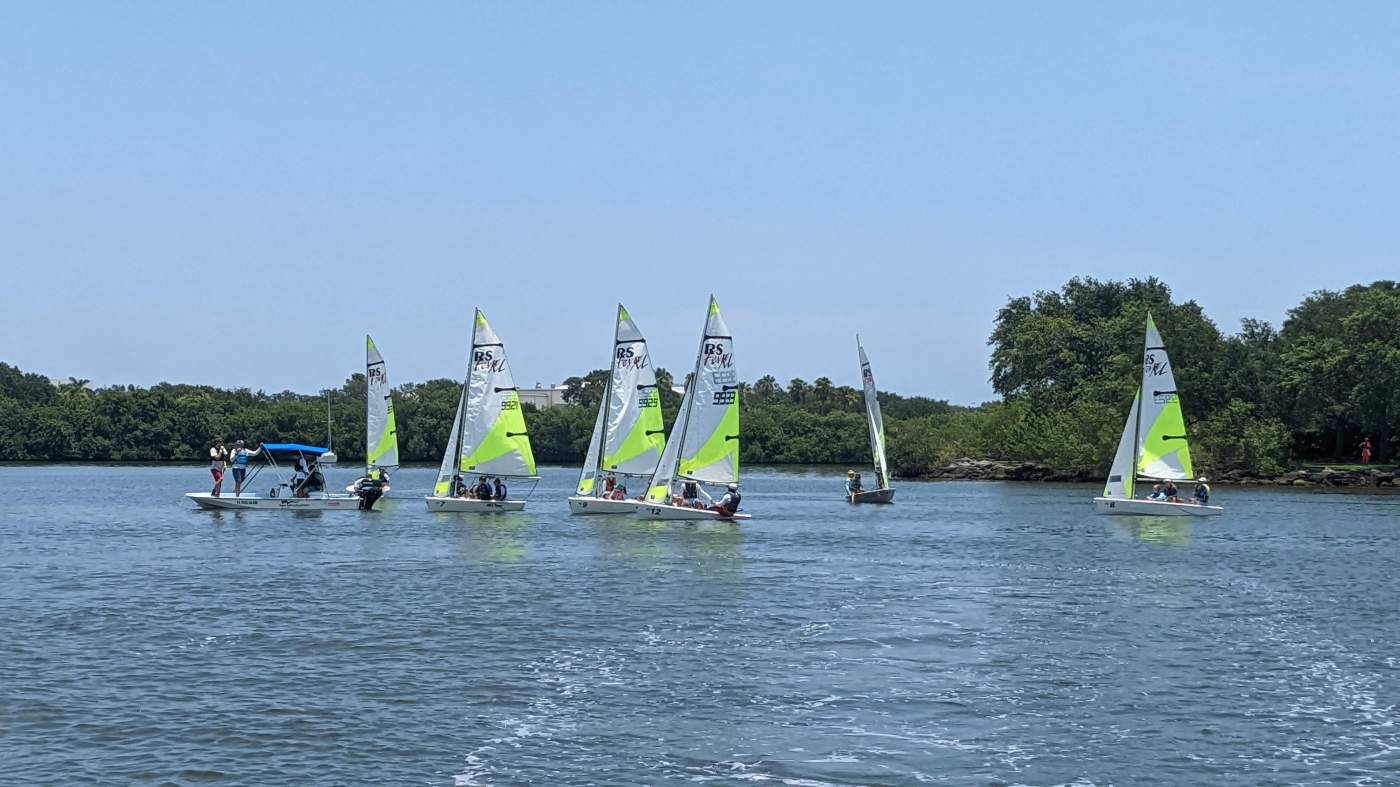 A group of sailboats sailing in the lagoon