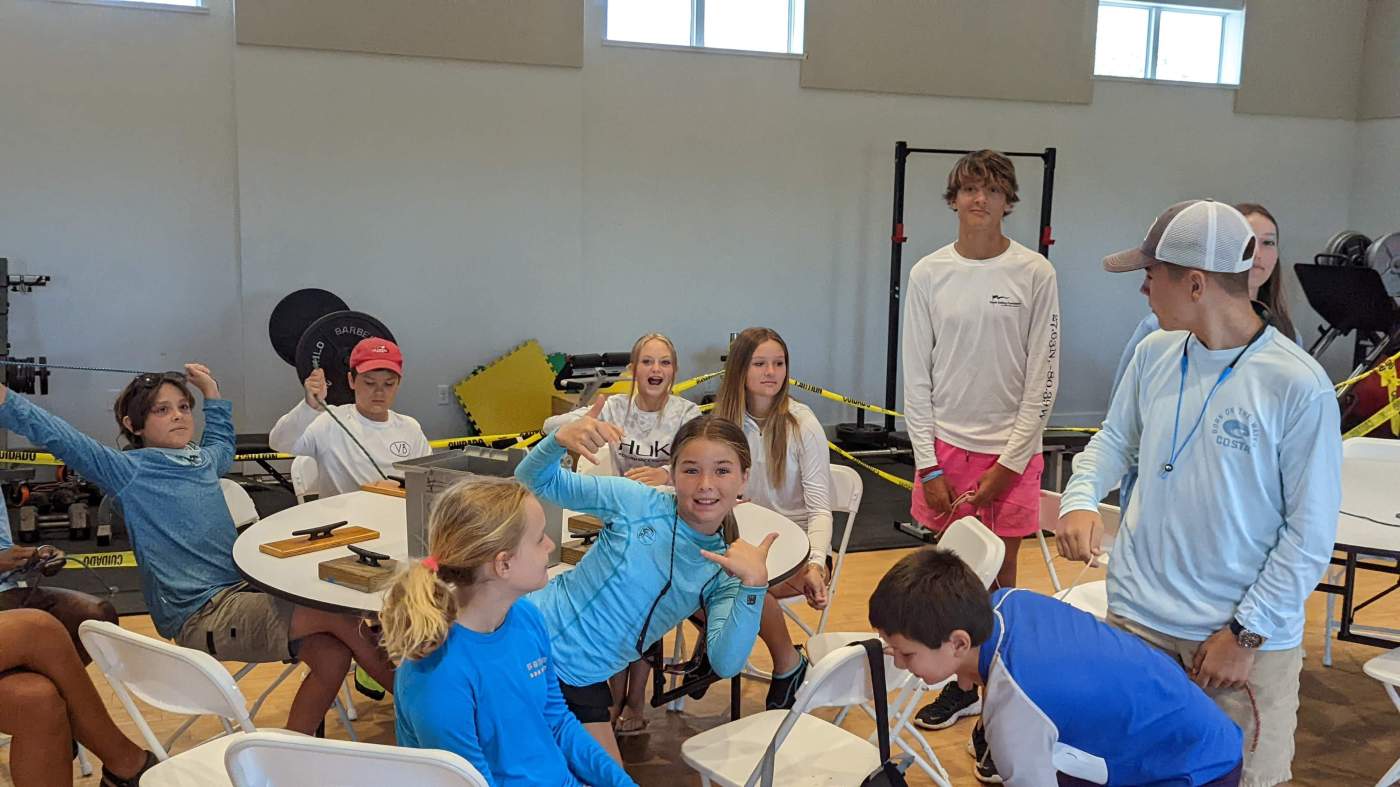 A group of children around a tables