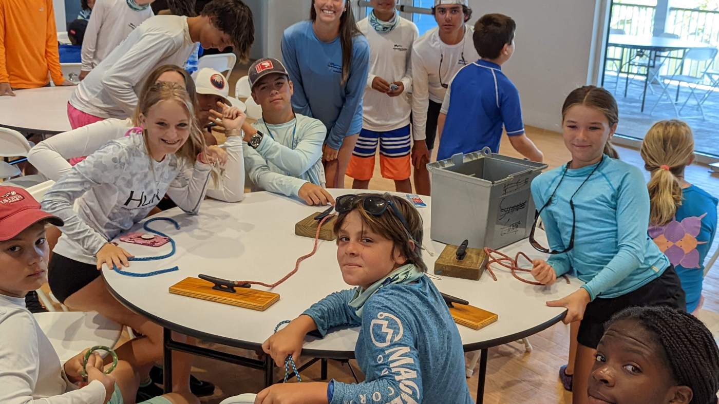 A group of children around a tables