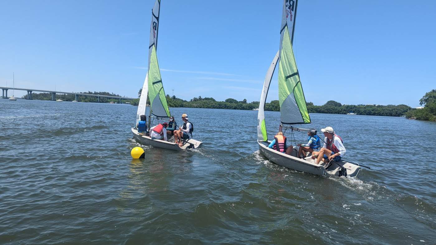 Sailboats rounding a buoy