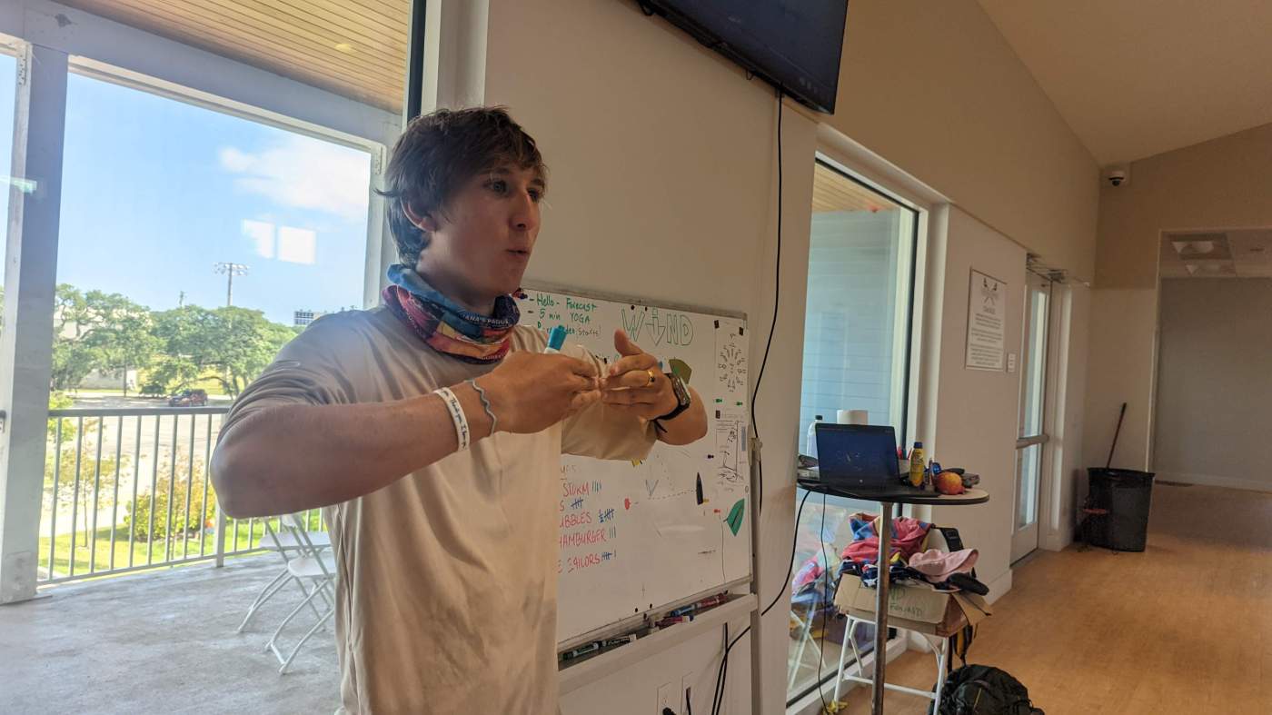 An instructor standing in front of a whiteboard