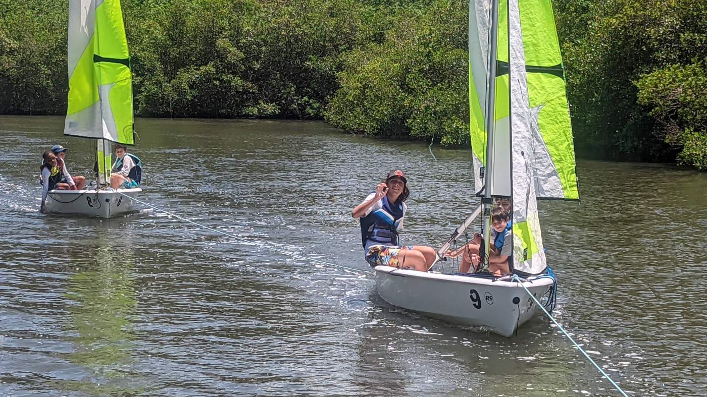 A sailboat in tow