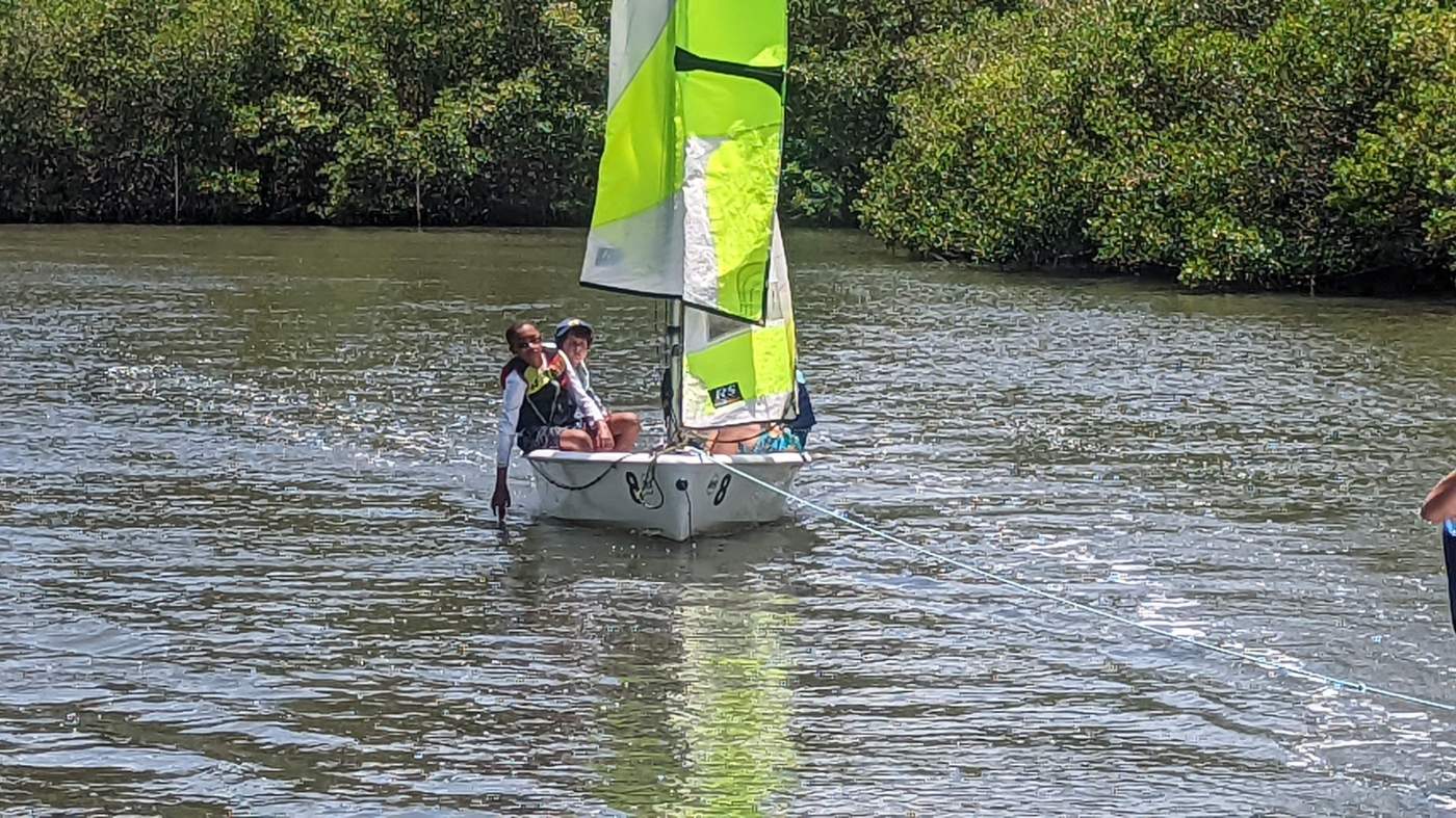 A sailboat and a powerboat out on the lagoon