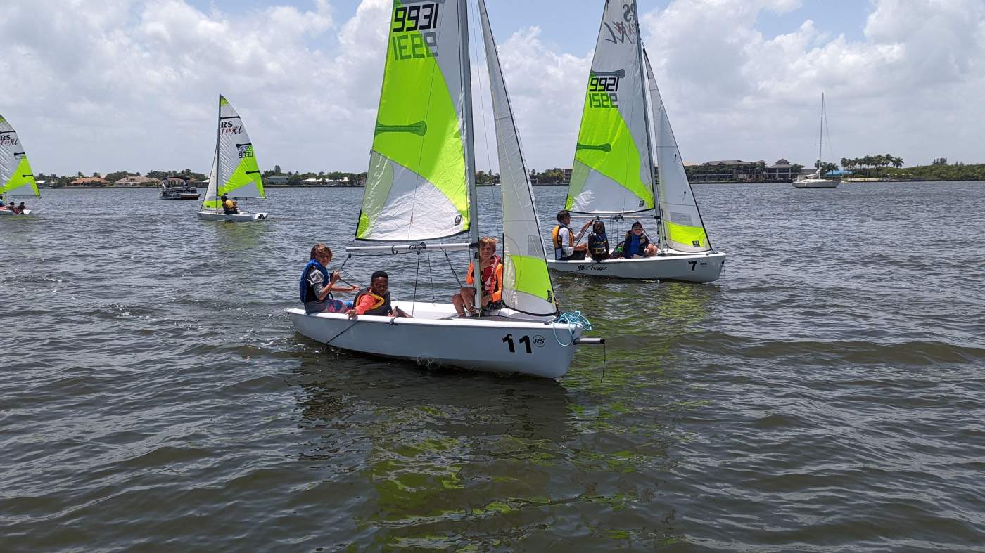 A group of sailboats sailing in the lagoon