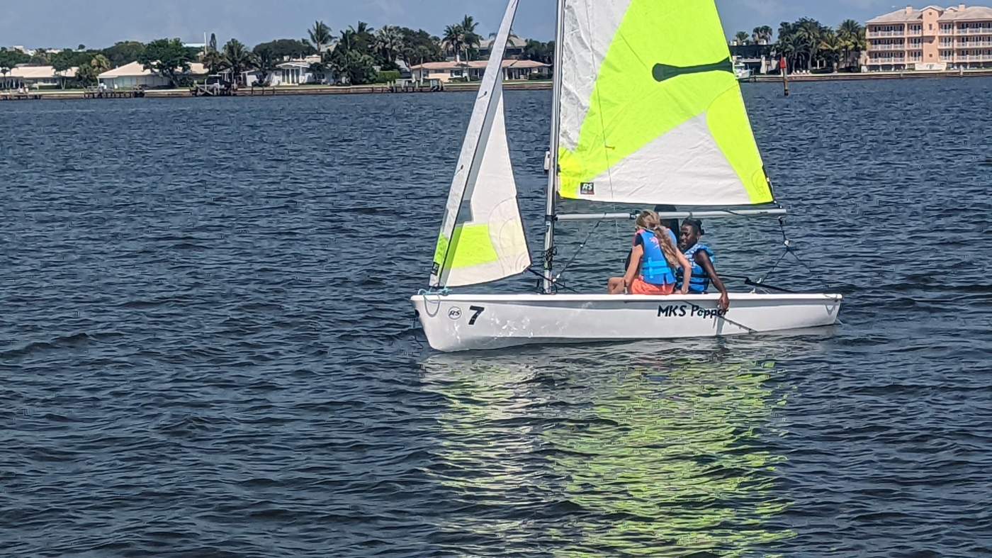 A lone sailboat on the lagoon
