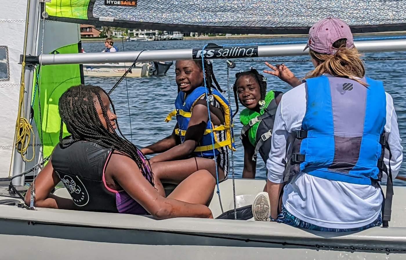 Four girls sailing a boat