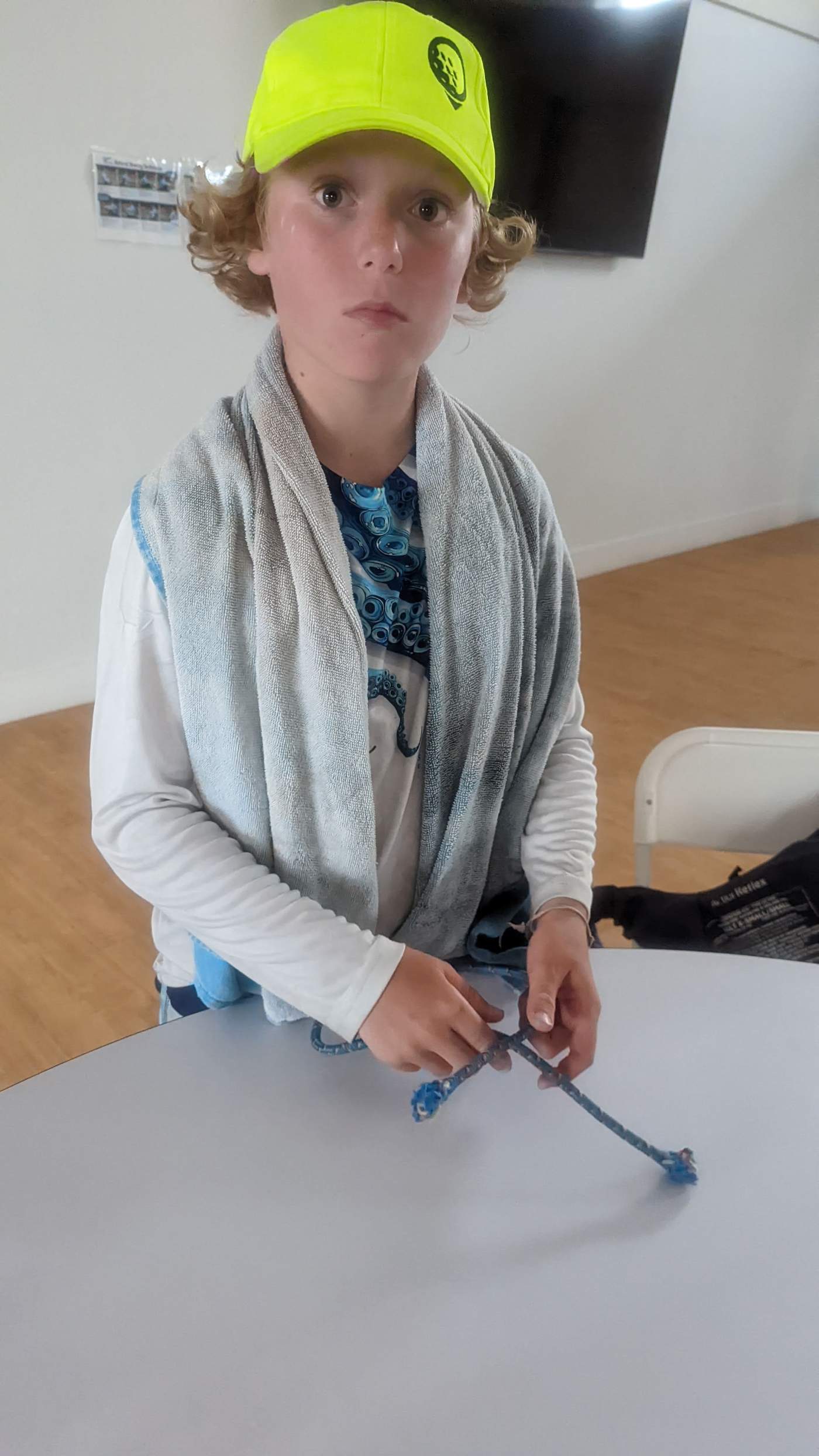 A girl practicing knot tying