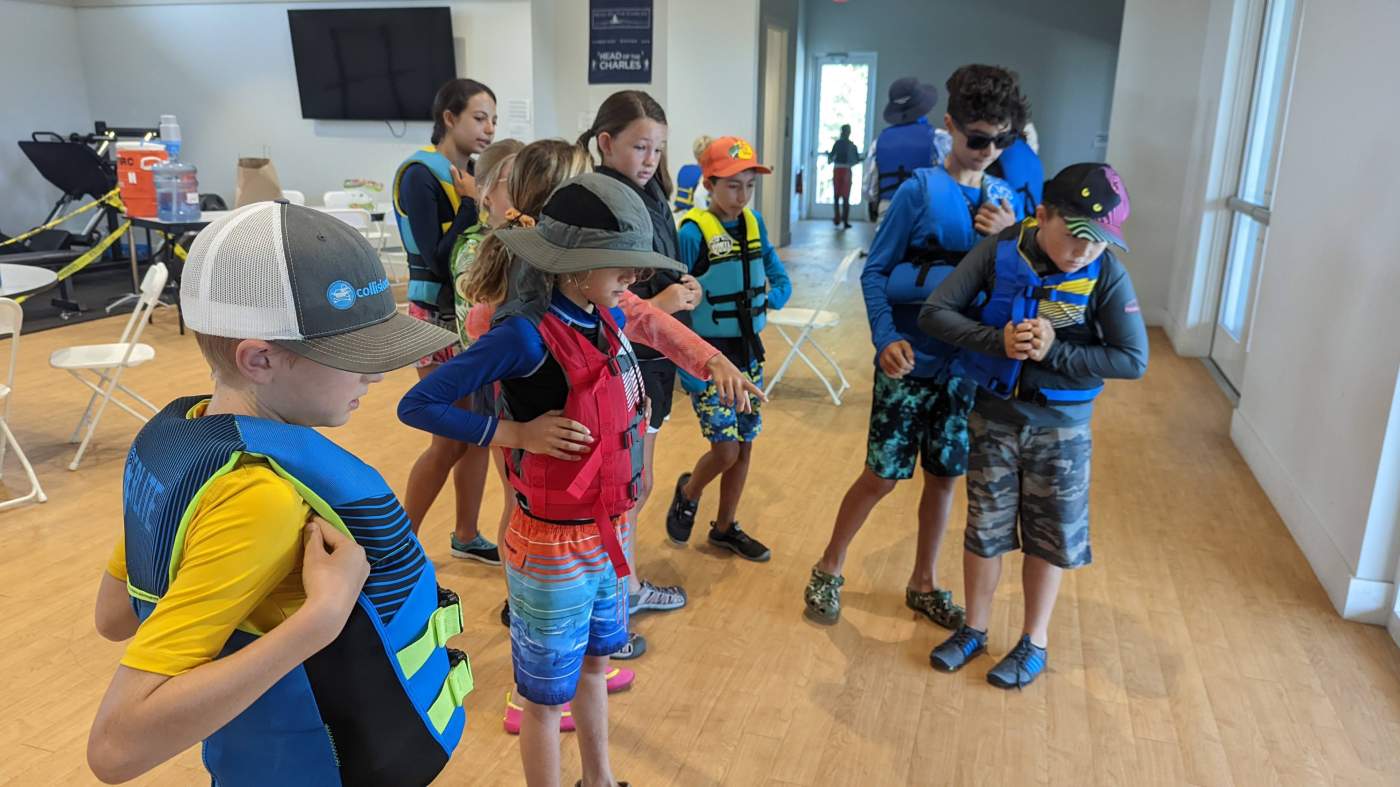 A group of children wearing lifejackets