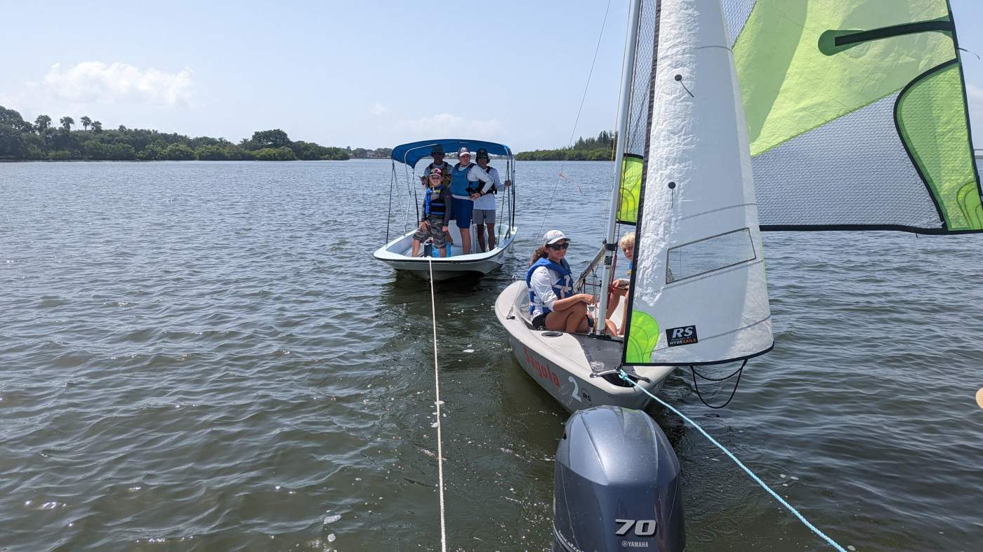 Two sailboats in tow