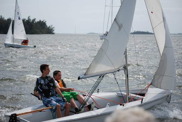 Two kids on a sailboat