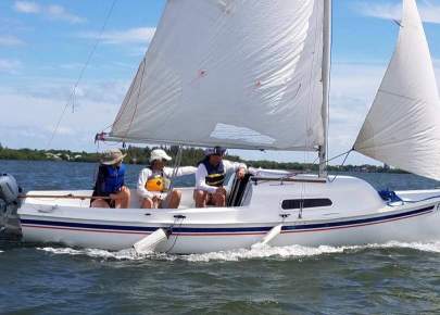 a group of adults sailing